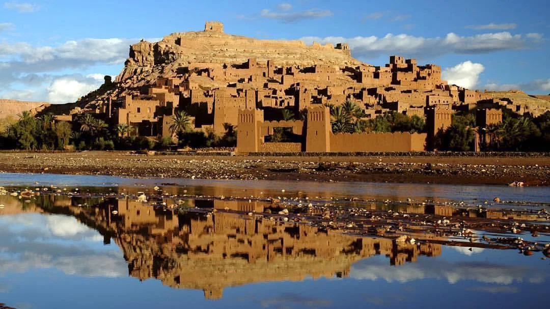 The earthen ksar of A&iuml;t Ben Haddou reflected in the Ounila river