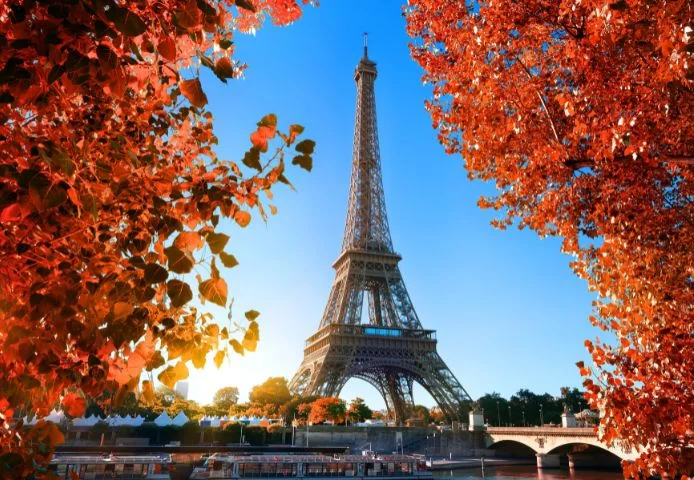 The Eiffel Tower framed by autumn foliage