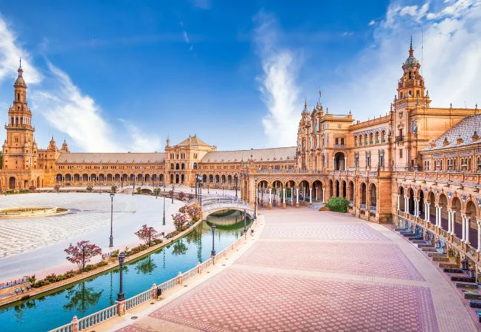 The curved colonnade and canal of the Plaza de Espa&ntilde;a, Seville